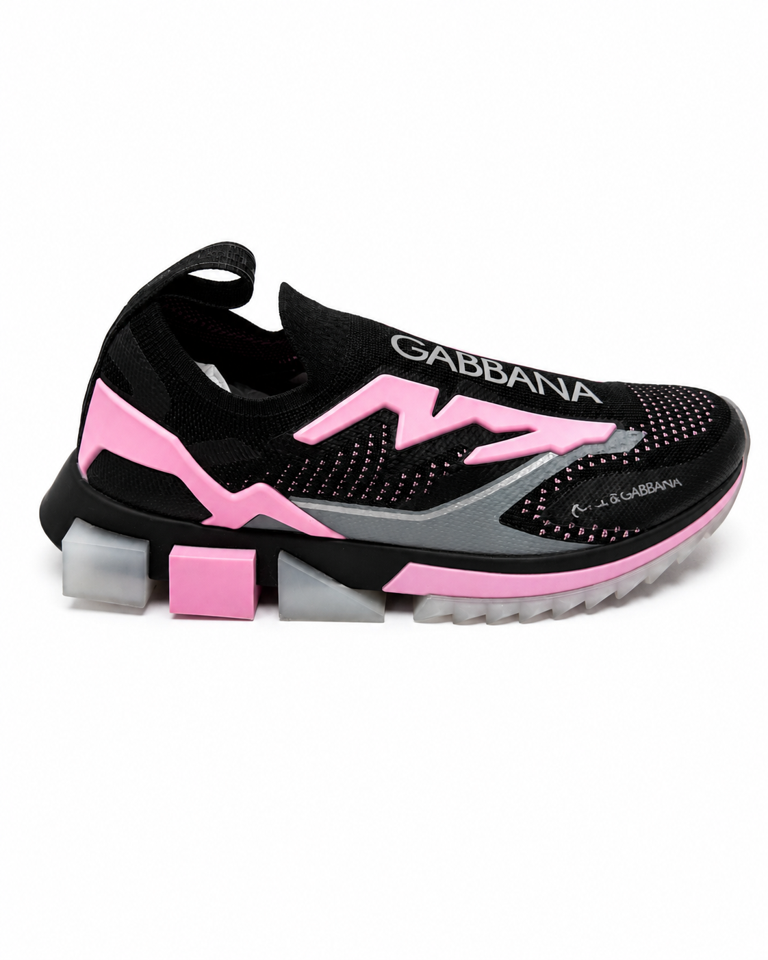 A black Gabbana slip-on sneaker with vibrant pink accents, featuring the brand name 'GABBANA' printed in white on the side and a chunky, blocky sole with pink and gray details, set against a plain white background.