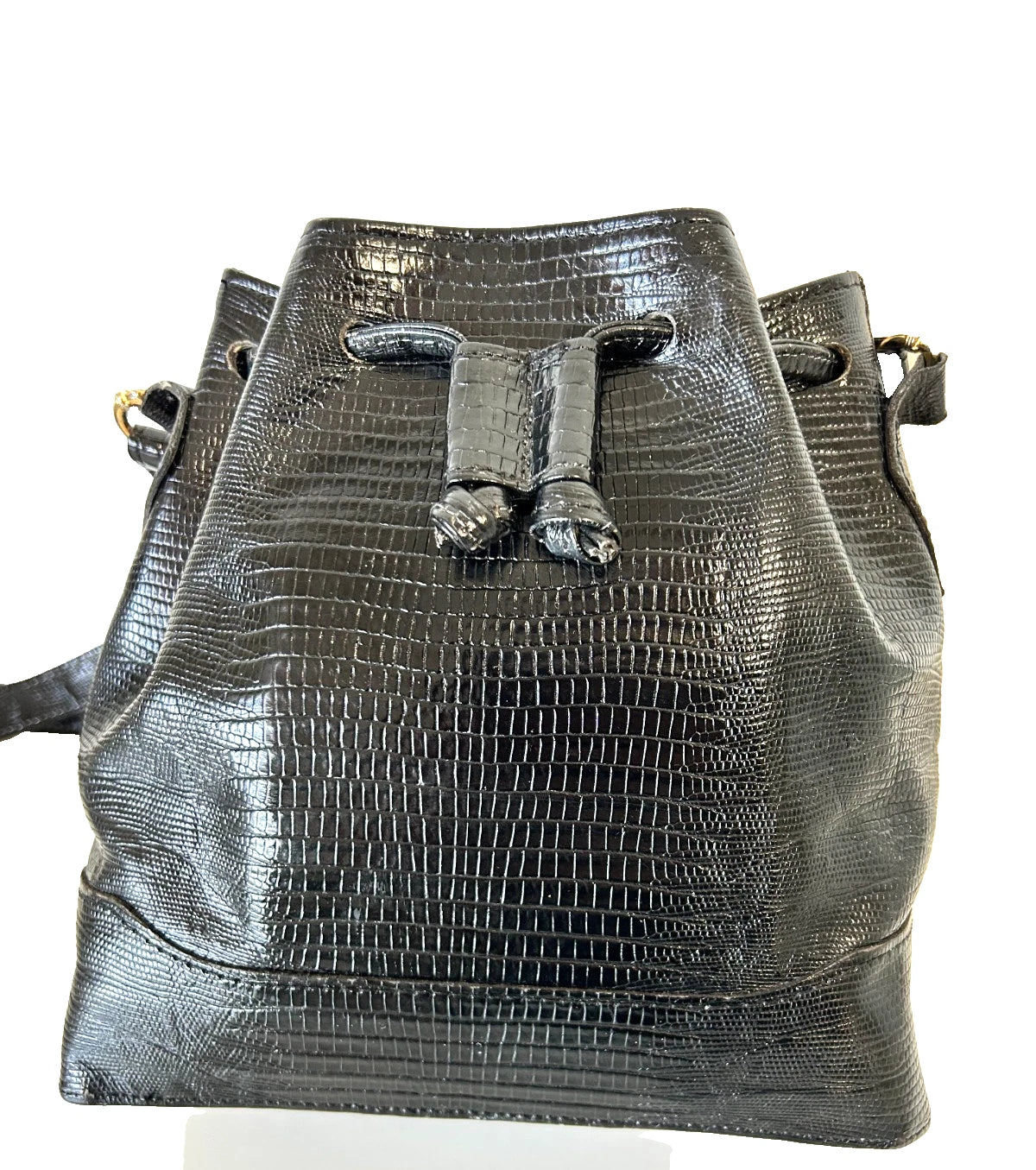 A black crocodile-embossed leather bucket bag with a drawstring closure and gold-tone hardware, shown against a plain white background.