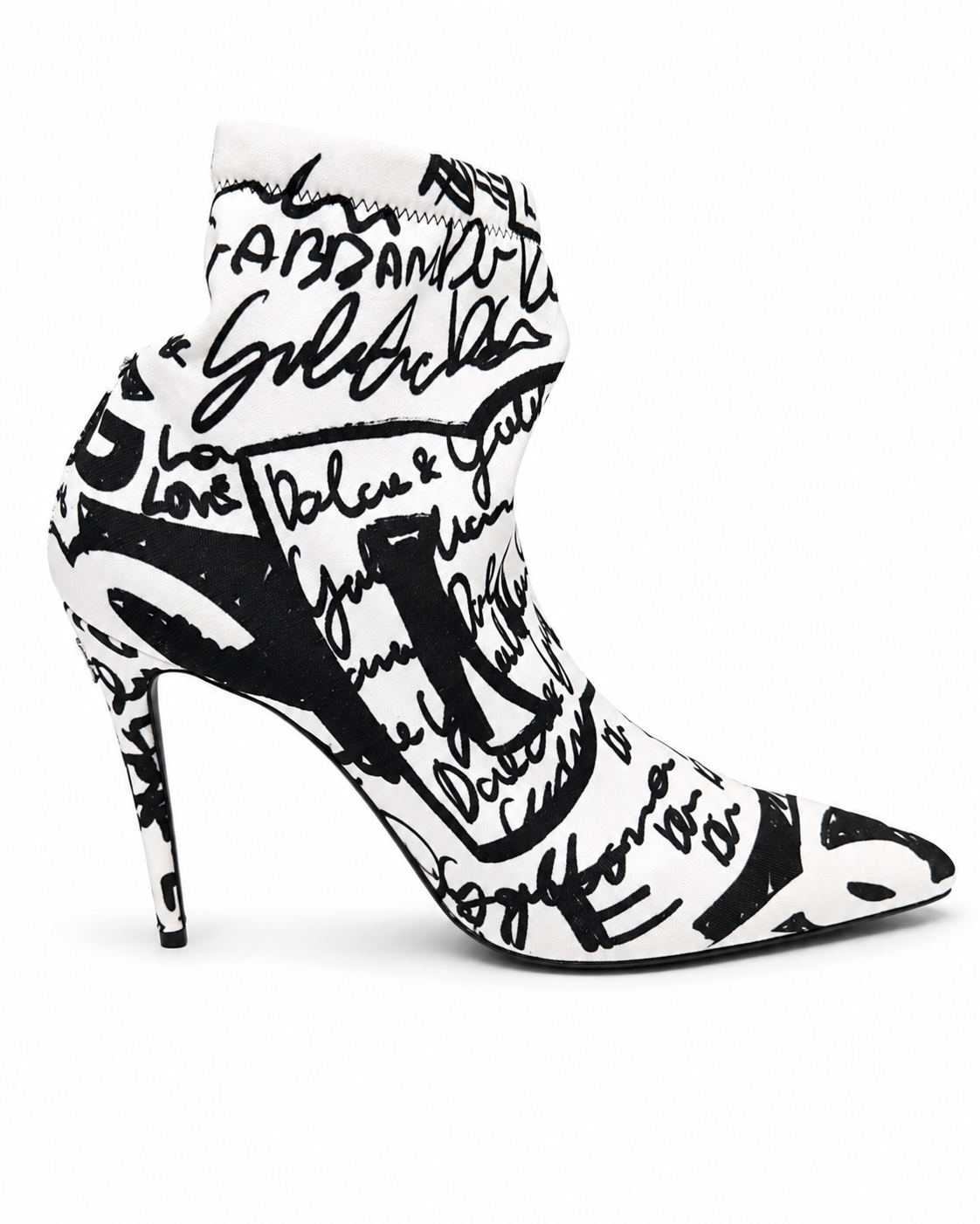 A pointed-toe stiletto ankle boot featuring a bold black and white graffiti-style graphic print with script and abstract lettering, shown against a plain white background.