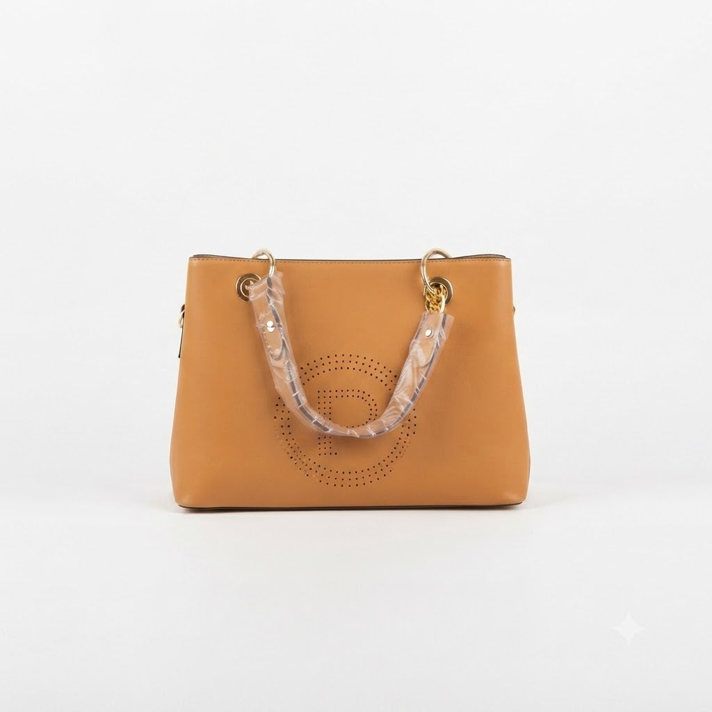 A tan leather handbag with a patterned translucent handle and gold-tone hardware, photographed against a plain white background.
