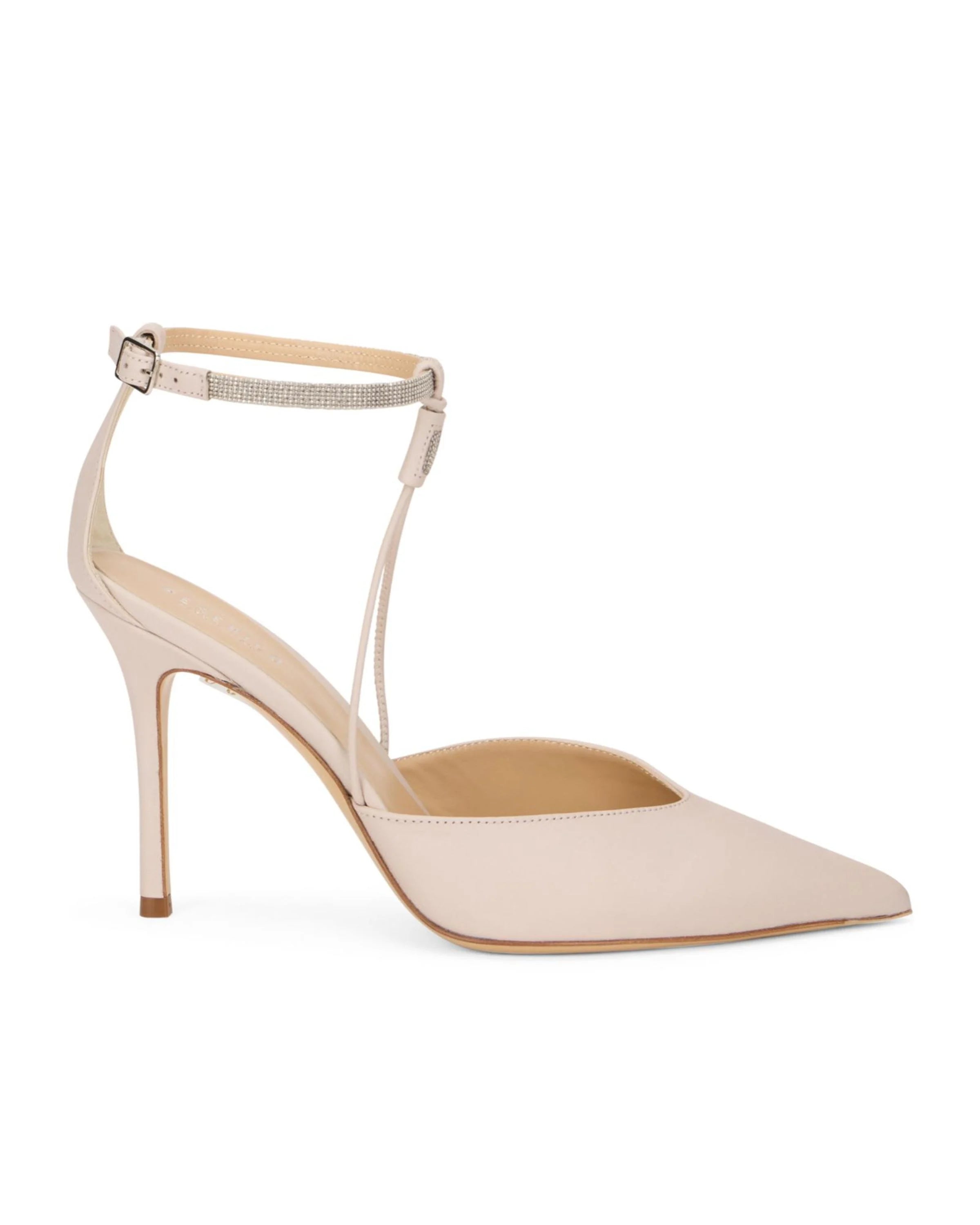 A single light beige pointed-toe high heel pump with a slim ankle strap and a small silver buckle, shown on a plain white background.